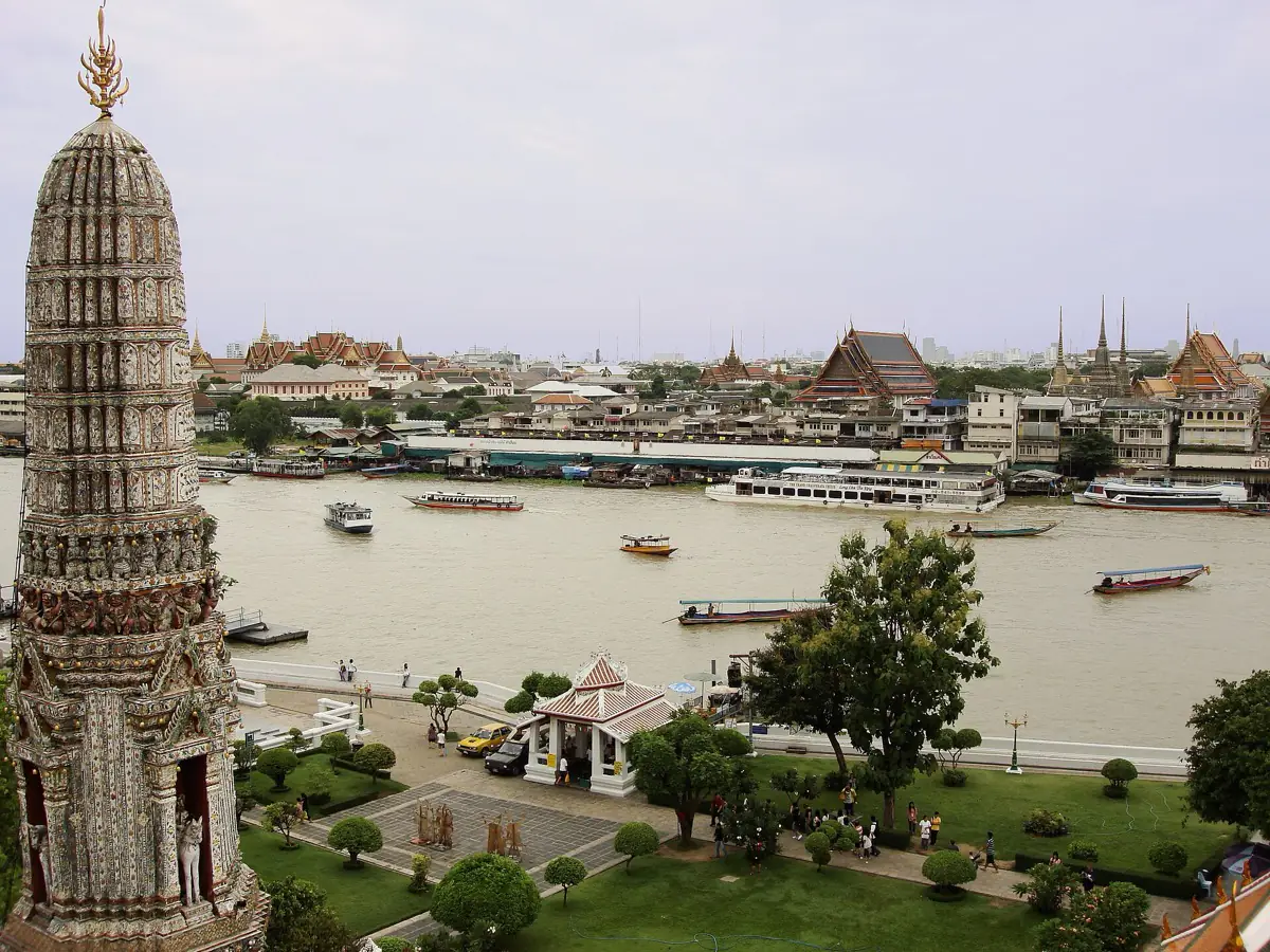View over the Chao Phraya river and its boats from the central prang of Wat Arun